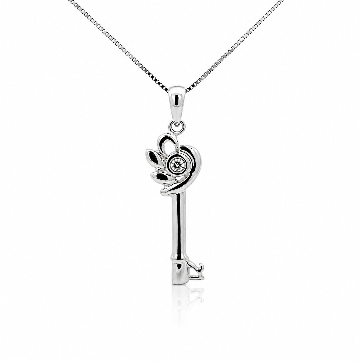 10K white gold diamond key pendant necklace featuring 0.81 CTW natural diamonds on a matching white gold box chain.