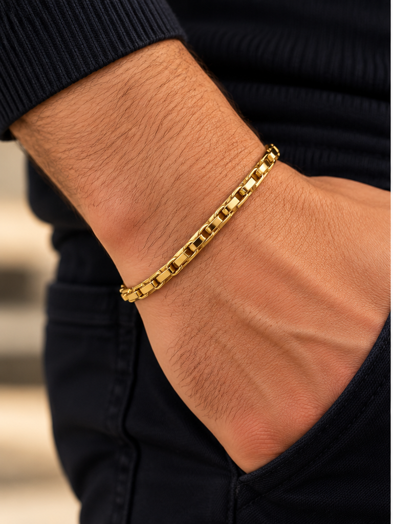 14K yellow gold men's geometric link chain bracelet featuring polished rectangular links, shown on a man's wrist with a black sleeve – La Noosha Jewelry.