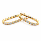 18K yellow gold elongated hoop earrings featuring 18 diamonds totaling 0.187 carats