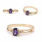 Elegant 14K gold ring featuring an oval-cut amethyst center stone with sparkling diamond accents