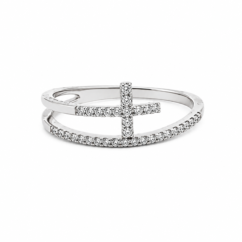 14K white gold diamond cross wrap ring featuring pavé-set round diamonds in a modern open-band design on a white background.