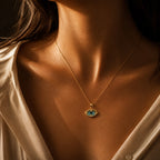 Model wearing a 14K gold evil eye necklace with blue enamel pendant, luxury fine jewelry styling and everyday elegance