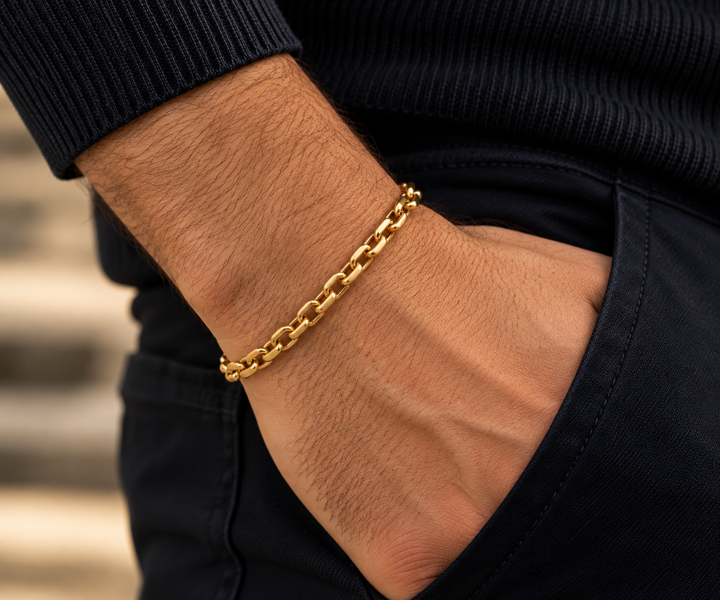 Luxury 14K yellow gold men's chain bracelet with 5.5mm links, styled on a man's wrist – LA Noosha Jewelry.
