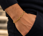 Luxury 14K yellow gold men's chain bracelet with 5.5mm links, styled on a man's wrist – LA Noosha Jewelry.