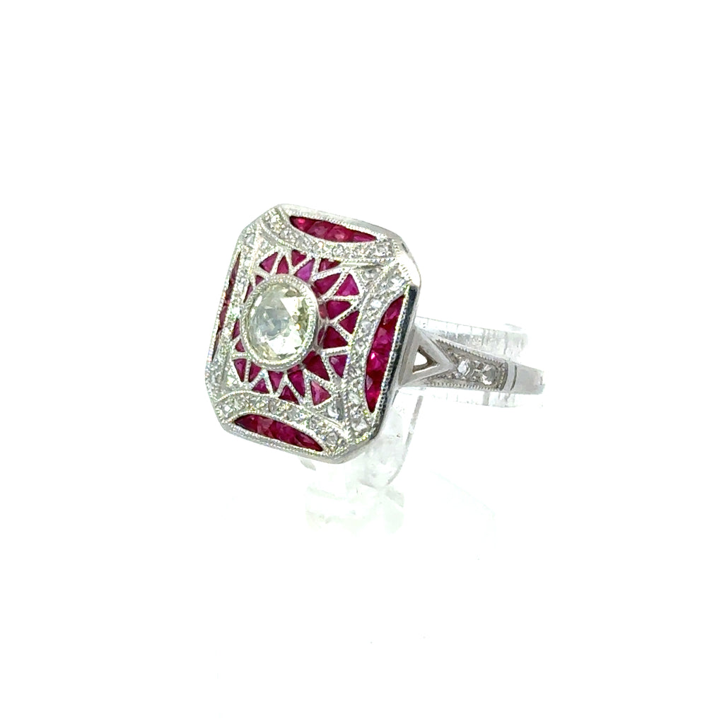 Luxury 18K Art Deco ruby and diamond ring with geometric vintage design on white background