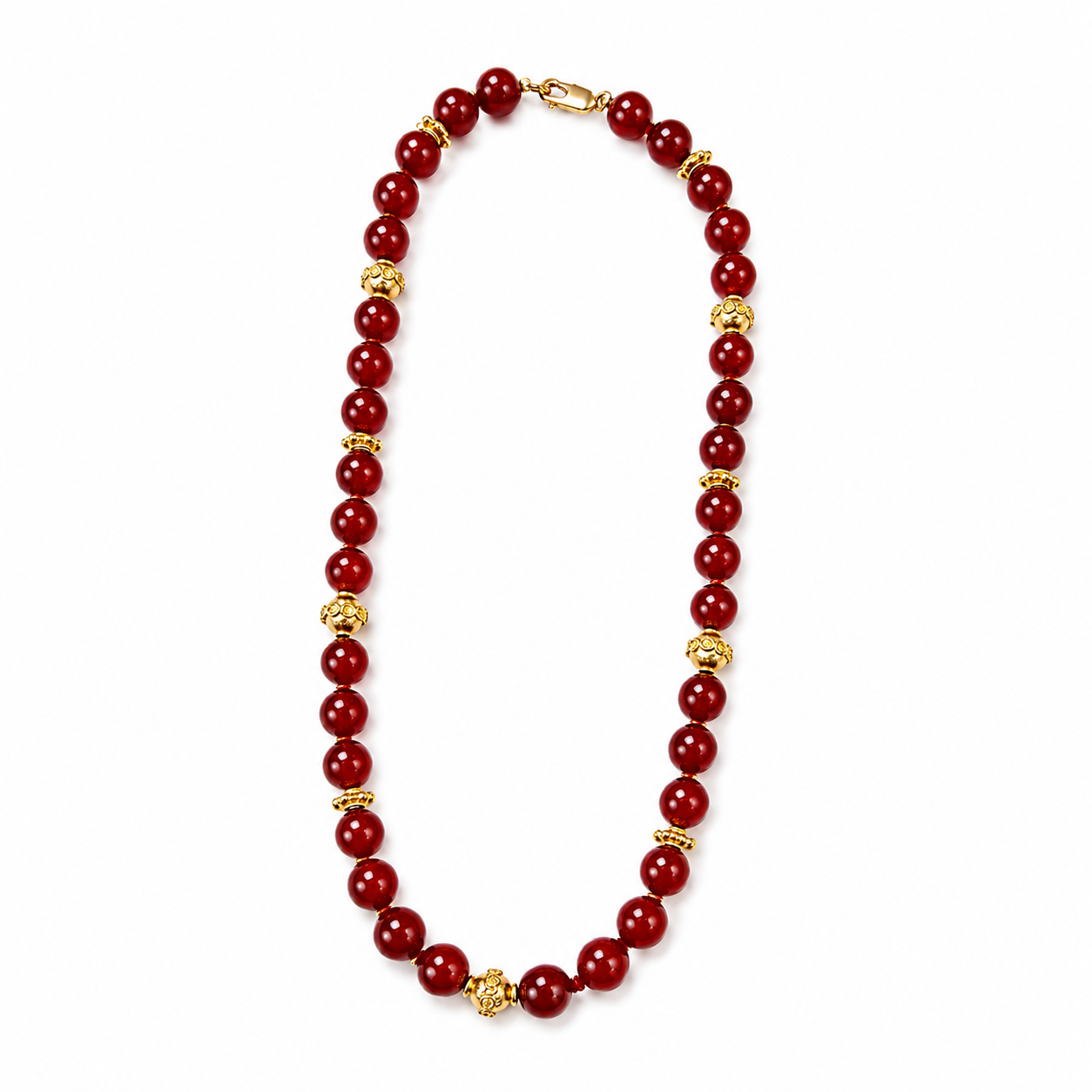 Red beaded necklace with gold accents on a white background