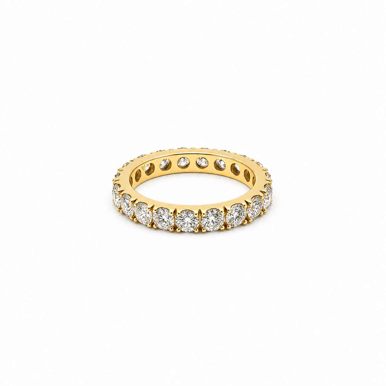 18K yellow gold eternity band featuring 3.75 carats total weight of round brilliant diamonds in a shared-prong setting.