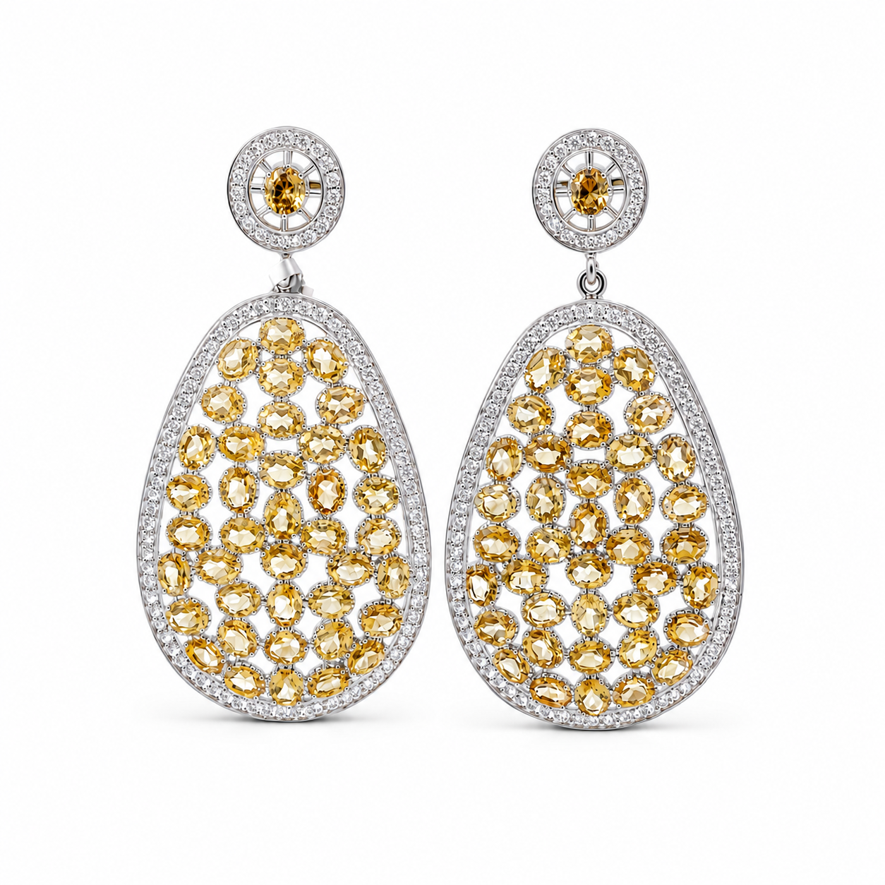 Sterling silver teardrop earrings featuring champagne citrine-colored gemstones and sparkling cubic zirconia accents in an elegant openwork design.
