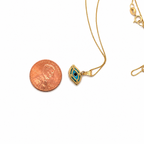 14K gold evil eye necklace with blue enamel pendant shown beside a U.S. penny for size reference on a white background