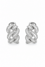 Model wearing 18K white gold diamond chain link earrings with baguette and pavé natural diamonds