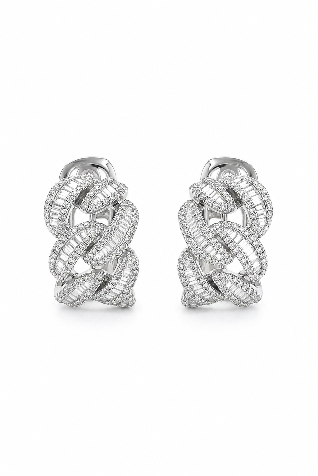 Model wearing 18K white gold diamond chain link earrings with baguette and pavé natural diamonds