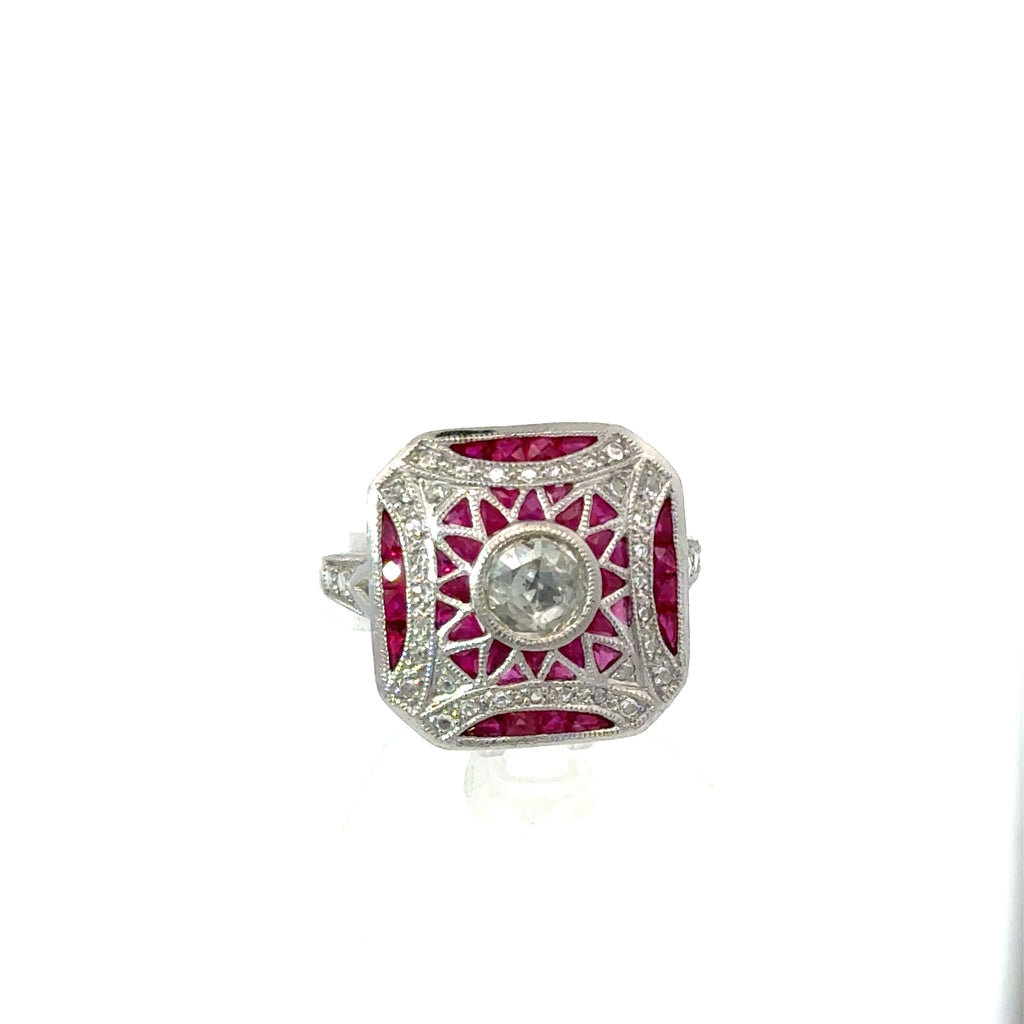 18K vintage Art Deco ruby and diamond ring on white background