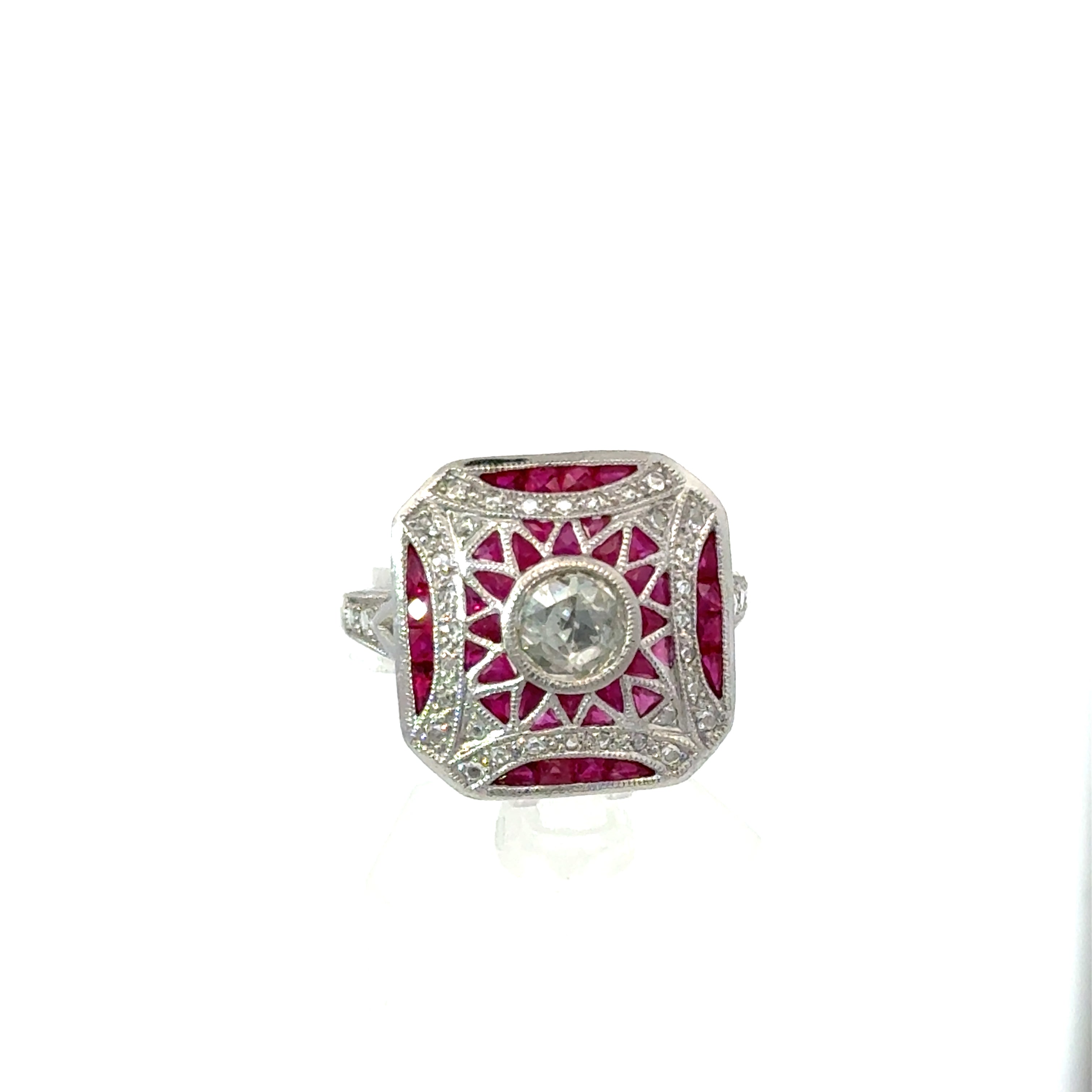 18K vintage Art Deco ruby and diamond ring on white background