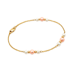 14K gold bracelet featuring white and blush freshwater pearls on a delicate station chain