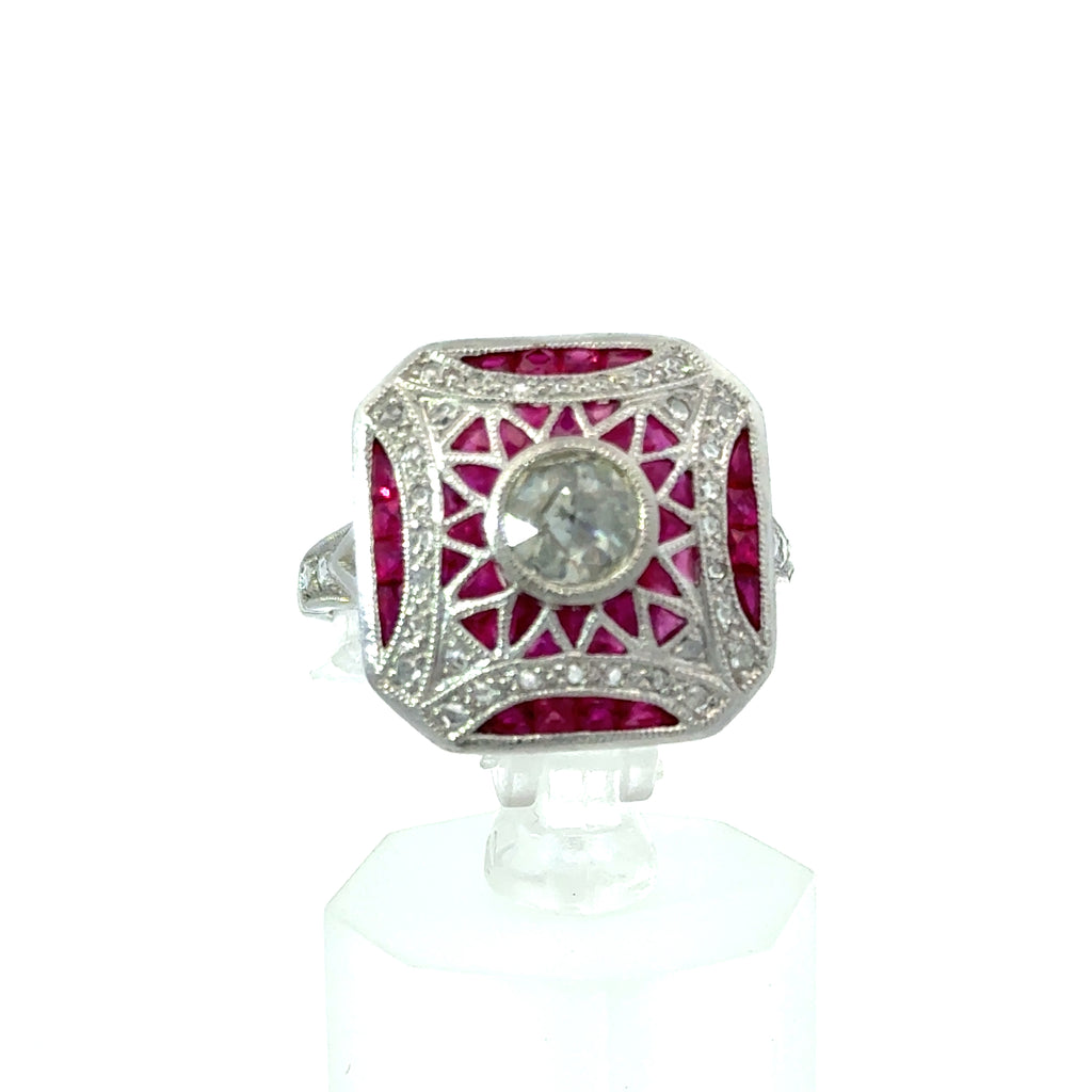 18K vintage Art Deco ruby and diamond ring on white background