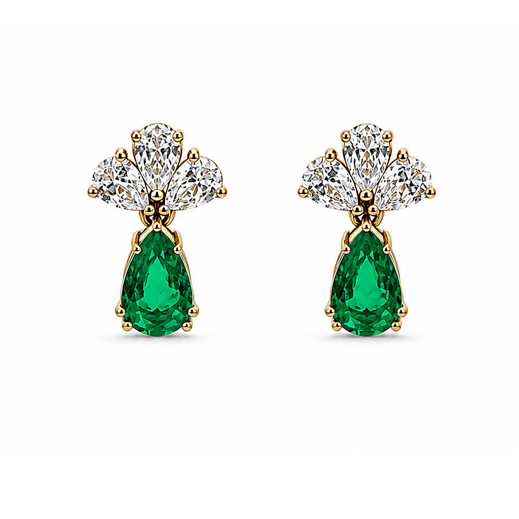 Natural emerald and diamond drop earrings in 18K gold on white background