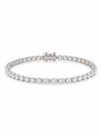 Elegant oval-cut lab-grown diamond tennis bracelet on a woman’s wrist beside soft pink roses, La Noosha Jewelry.