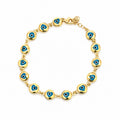 14K yellow gold evil eye bracelet with blue enamel accents on a delicate chain, luxury fine jewelry designed in Los Angeles