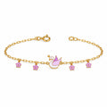 Kids gold bracelet with a crowned white swan and four purple flower charms