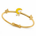 Kids gold bangle with a white teddy bear yellow moon and butterfly accents