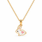 Kids gold necklace with a white bunny and pink heart pendant