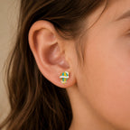 Child wearing a small colorful yellow gold hot air balloon stud earring