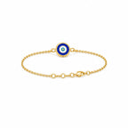 Back view of kids yellow gold reversible bracelet featuring a blue evil eye with the clasp visible