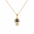14K yellow gold Hamsa evil eye necklace featuring blue enamel and sparkling CZ stones on a delicate gold chain