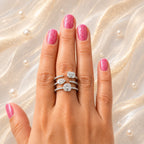 18K gold diamond statement ring worn on hand featuring Asscher and pear cut diamonds