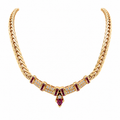 14K gold ruby and diamond necklace featuring natural ruby gemstones and sparkling diamond accents in an elegant statement design