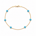 14K gold blue evil eye bracelet with blue enamel charms on a delicate station chain